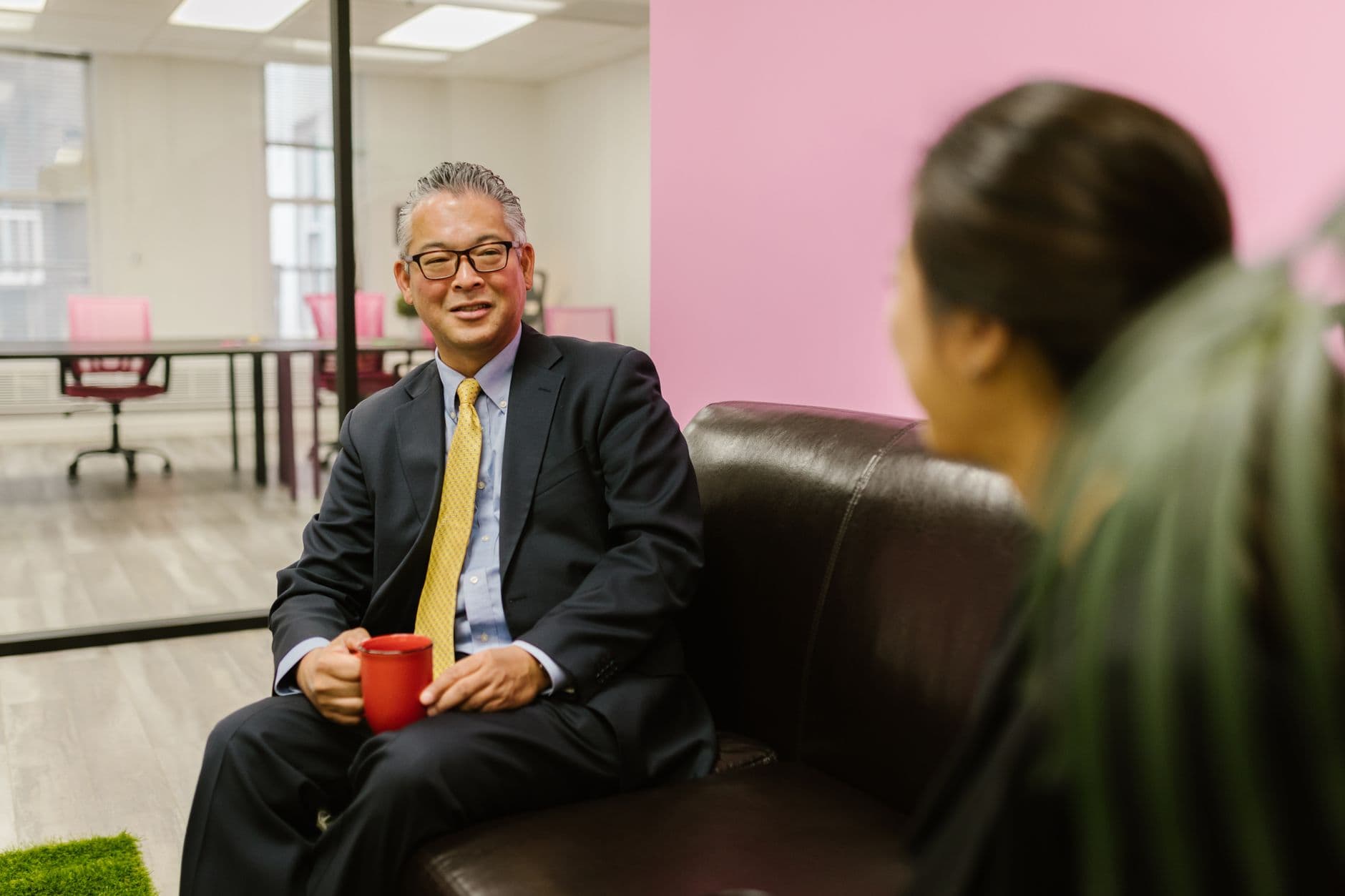 Two colleagues in a focused one-to-one conversation
