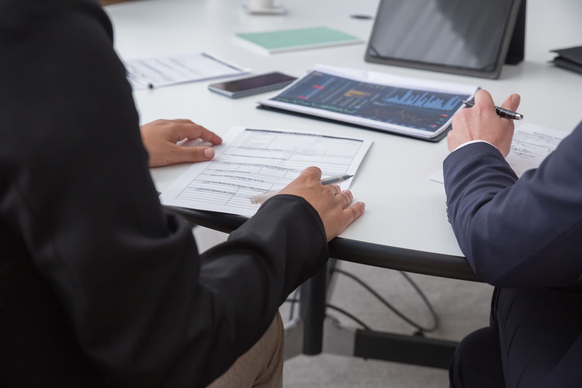 Two professionals reviewing assessment results together
